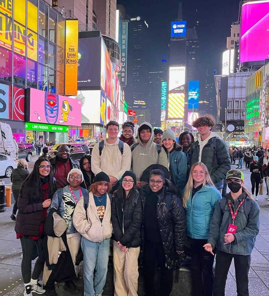 Students pose in Times Square during a NYC trip